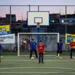 Brazilian community athletes in a neighborhood field promoting inclusion through sport